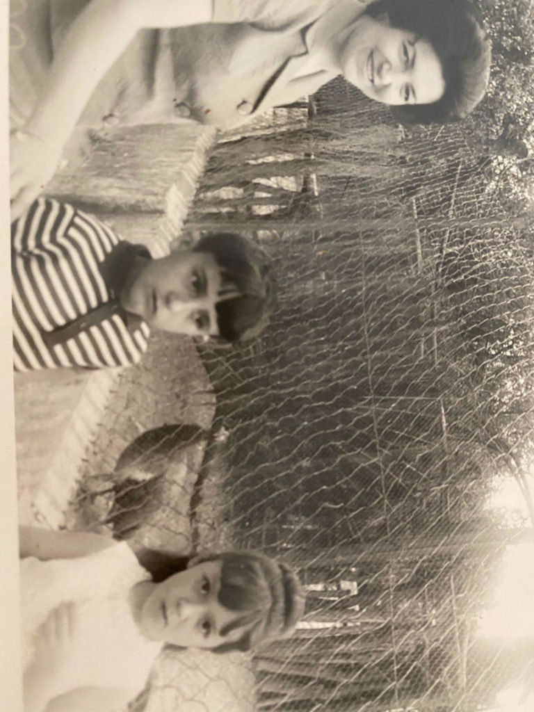 Young Laura with mom and brother