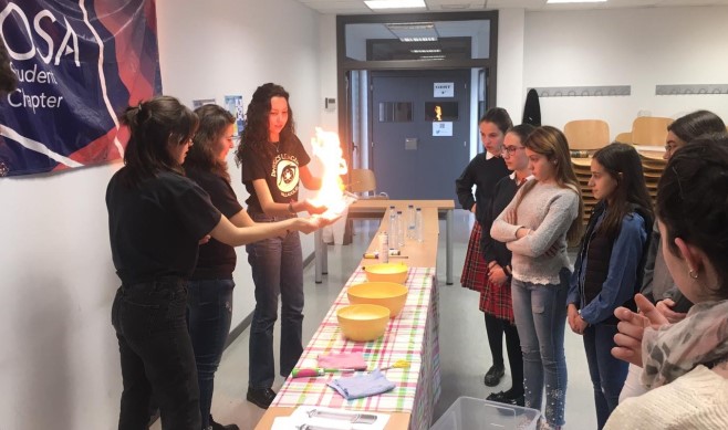OSA Student Chapter members from the Universidad de Valladolid demonstrate optics and photonics to attendees at their STEM Girl Talent Program for high school students.